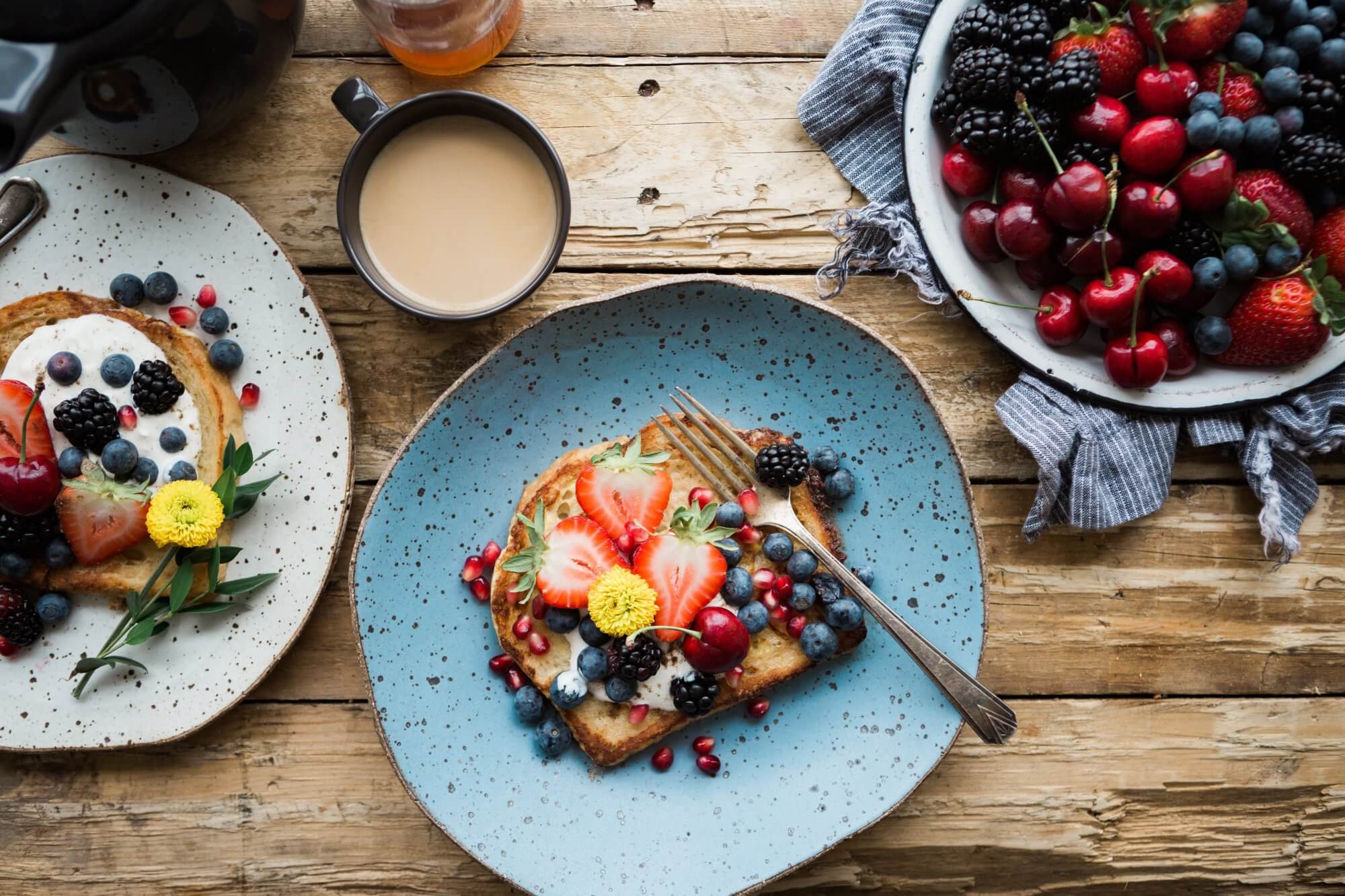 A plate of food on top of a wooden table.